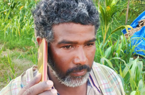 Indian farmer on mobile phone