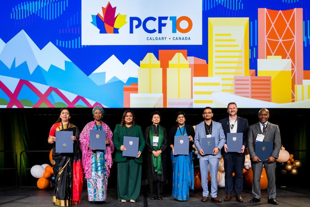 Photo of COL Honorary Fellows on stage at PCF10